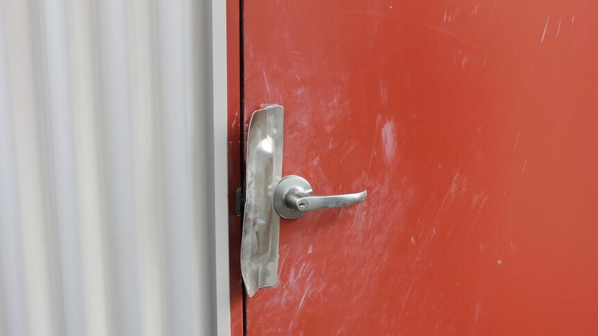 A damaged door at the Snake Valley CFA station, which was broken into over the weekend.