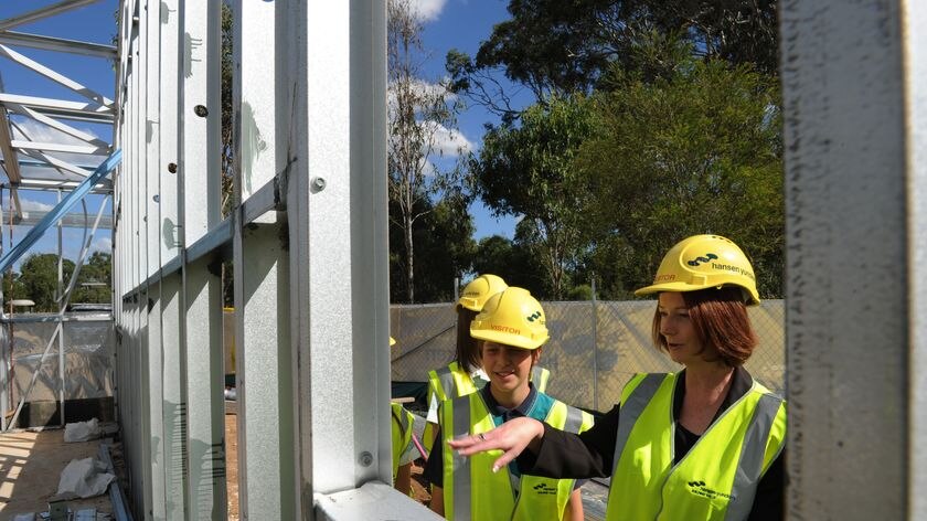 Federal Education Minister Julia Gillard (right) tours construction work at a school