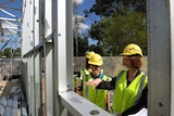 Federal Education Minister Julia Gillard (right) tours construction work at a school