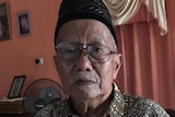 Elderly Indonesian man Andi Monji poses for a photo.