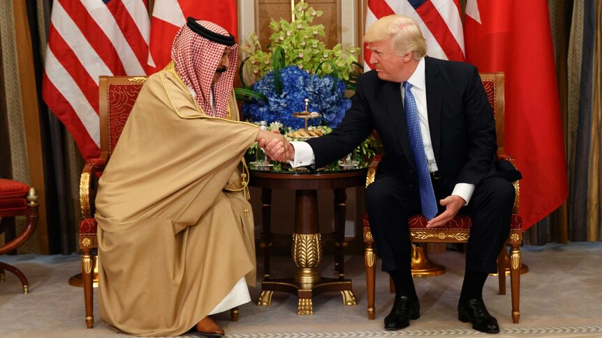 Donald Trump shakes hands with Bahrain's King Hamad bin Isa Al Khalifa.