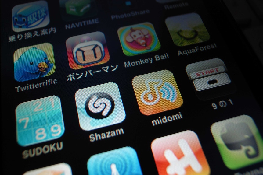 A row of icons on a smartphone, including Shazam