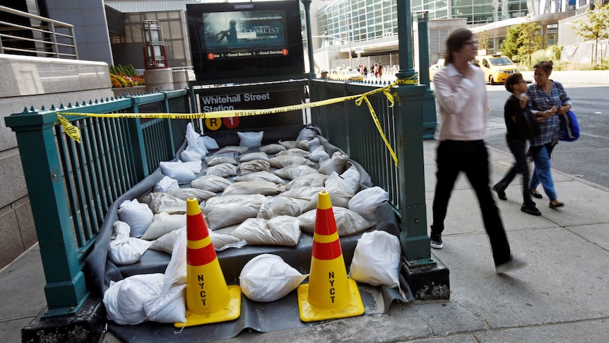 Sandbags cover the entrance of a NYC subway station