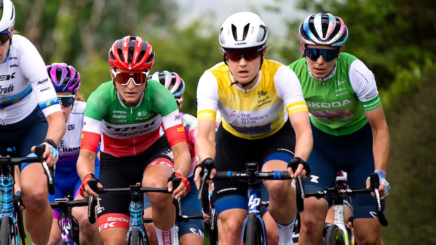 Three female cyclists competing during a road race in Wales