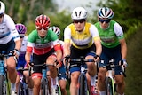 Three female cyclists competing during a road race in Wales