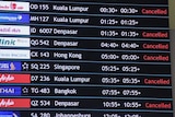 The arrivals board at Perth International Airport displaying a large number of cancelled flights.