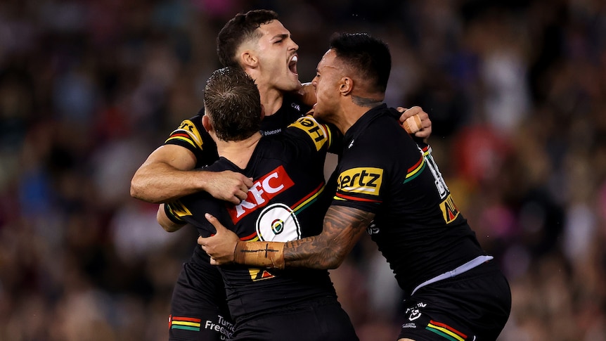 Nathan Cleary is hugged by his teammates