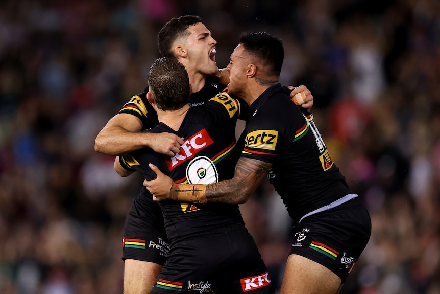 Nathan Cleary is hugged by his teammates