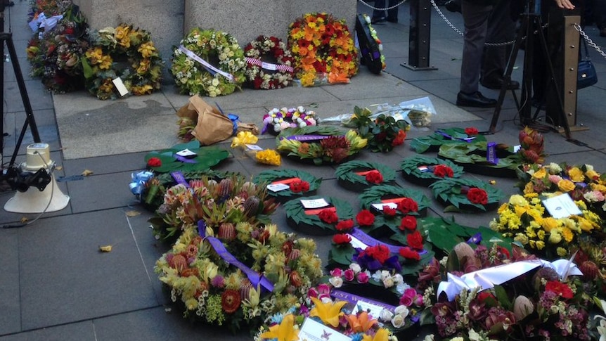 Wreaths lie at the base of the Sydney Cenotaph.