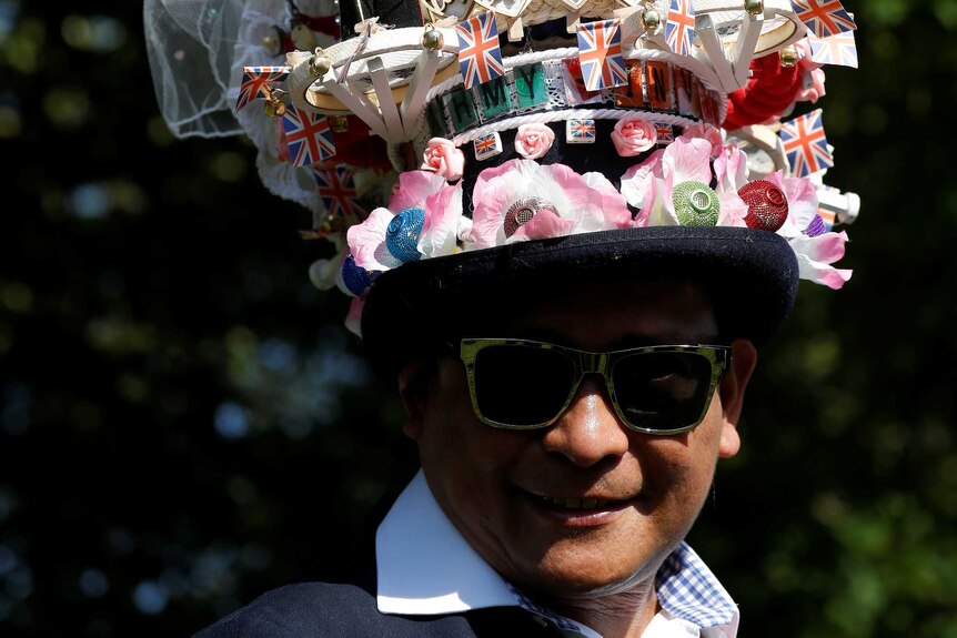 A fan wears a hat ahead of the wedding of Britain's Prince Harry to Meghan Markle.