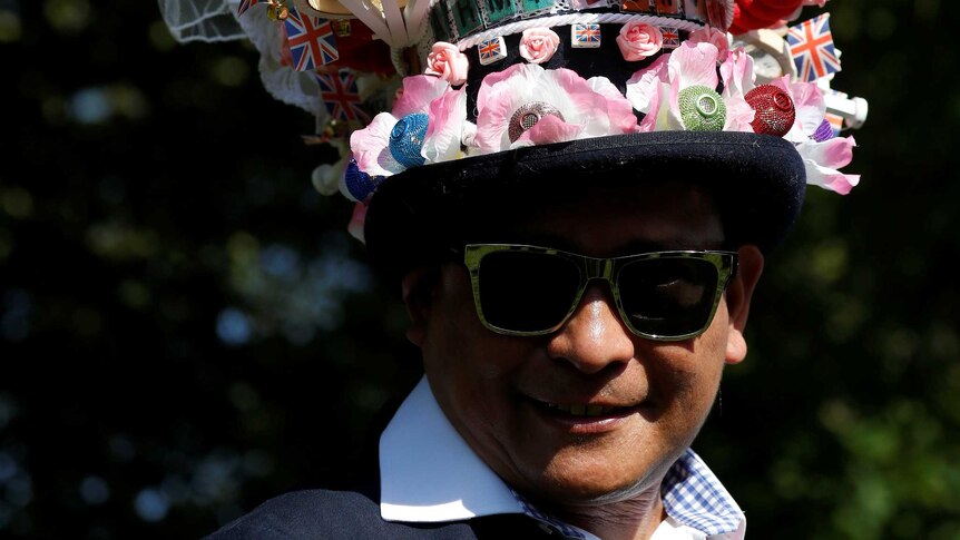 A fan wears a hat ahead of the wedding of Britain's Prince Harry to Meghan Markle.