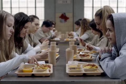 A shot from the TV show Orange is the New Black in the prison cafeteria.