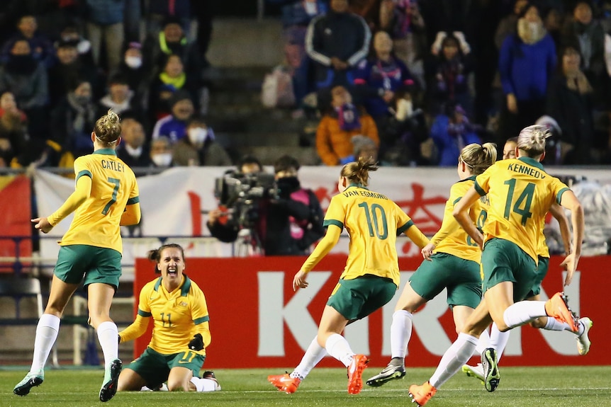Matildas celebrate scoring their first goal against Japan