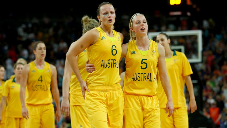 Australia's Jennifer Screen (L) and Samantha Richards walk off the court after the loss.