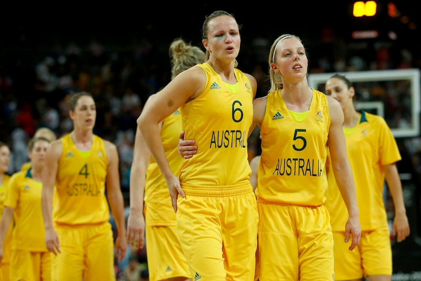 Australia's Jennifer Screen (L) and Samantha Richards walk off the court after the loss.