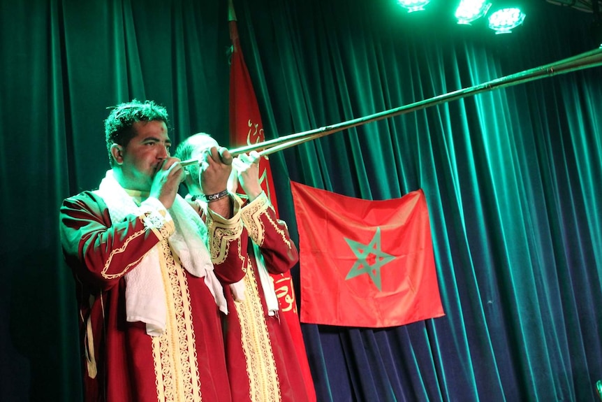 Fez Hamadcha member playing a n'ifr horn