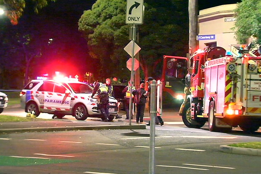 Police officers in a North Melbourne street.