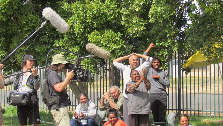 Camera operator and sound technician film for the Emu Runner