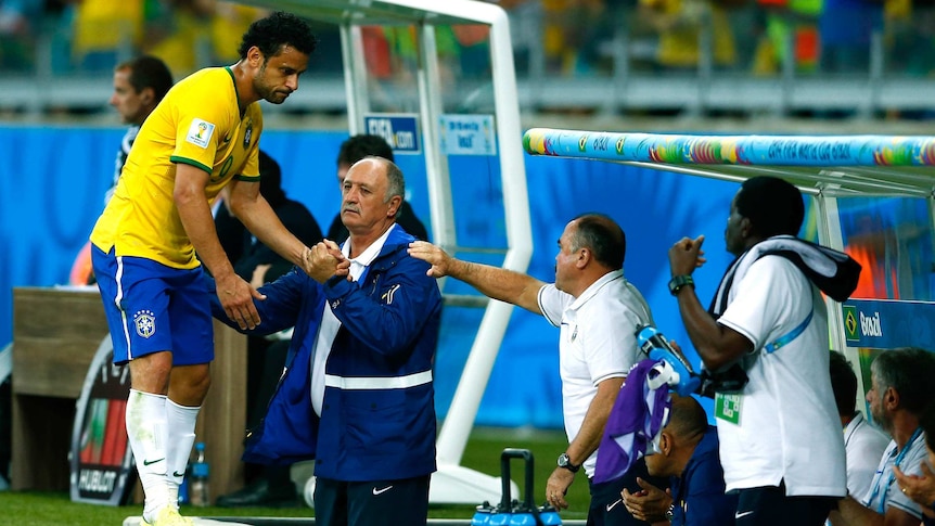 Brazil's Fred leaves the pitch after being subbed against Germany in the 2014 World Cup semi-final.