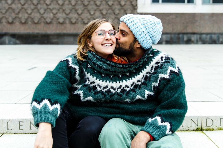 A couple in a relationship share the same oversized jumper but experts say time apart is important too.