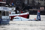 Rescue boats surround a US Airways plane as it floats in the Hudson River