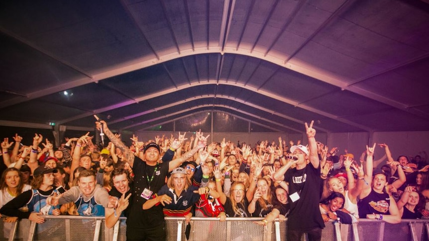 Schoolies partying in one of the event's concert tents