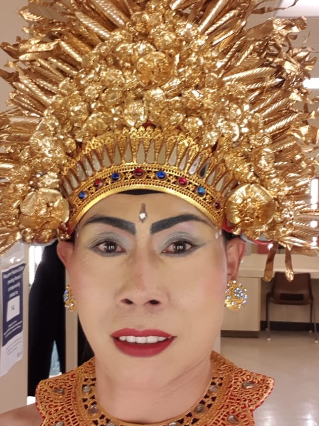 a headshot a man with balinese dancer costum