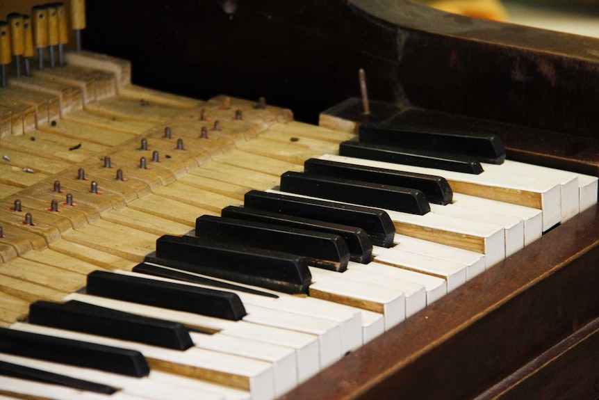 Close up shot of piano keys from an old piano.