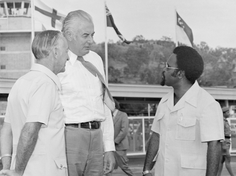 Prime Ministers Gough Whitlam and Michael Somare in 1975 standing together.