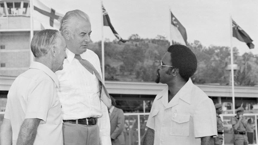 Prime Ministers Gough Whitlam and Michael Somare in 1975 standing together.