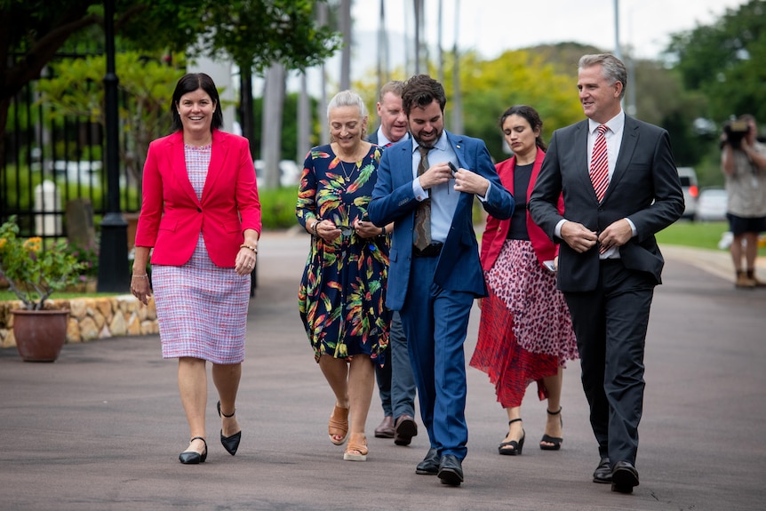 Labor members walking near Government House in Darwin.