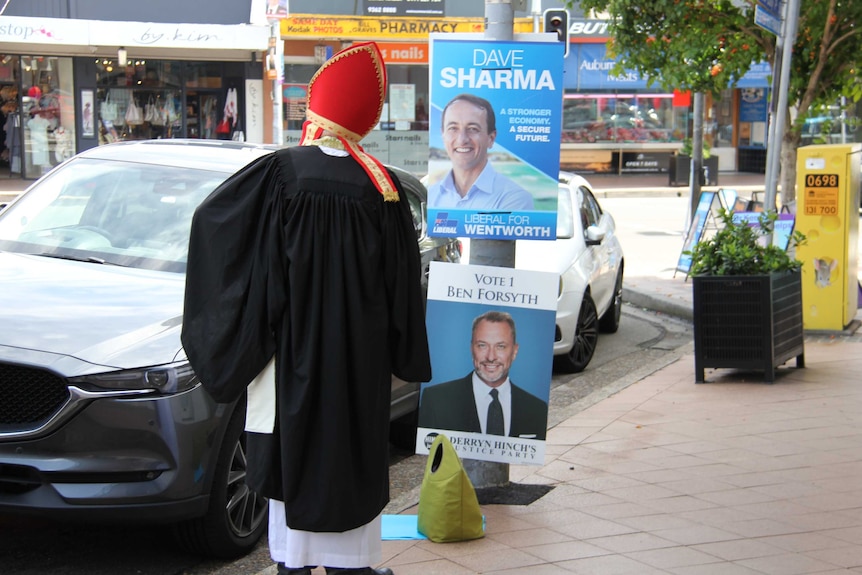 SAS Story: Priest outside Rose Bay pre-polling booth