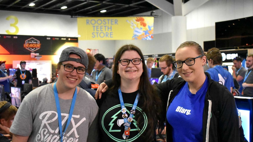 Rachael Osborne poses with two friends at the Rooster Teeth convention in Sydney.