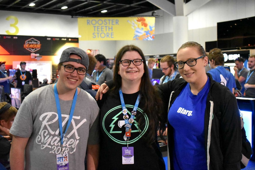 Rachael Osborne poses with two friends at the Rooster Teeth convention in Sydney.