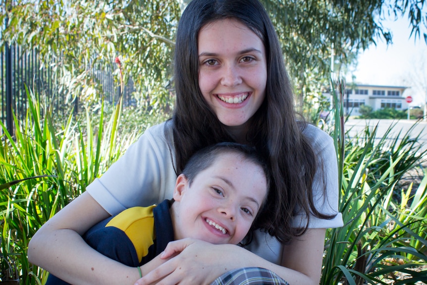 Kelsey and Trey Wade share a cuddle.