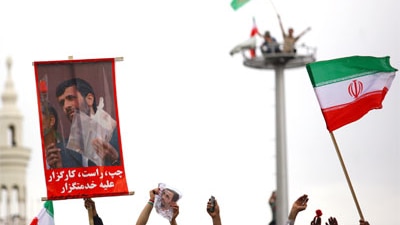 Supporters of Iranian President Mahmoud Ahmadinejad celebrate his election win this month