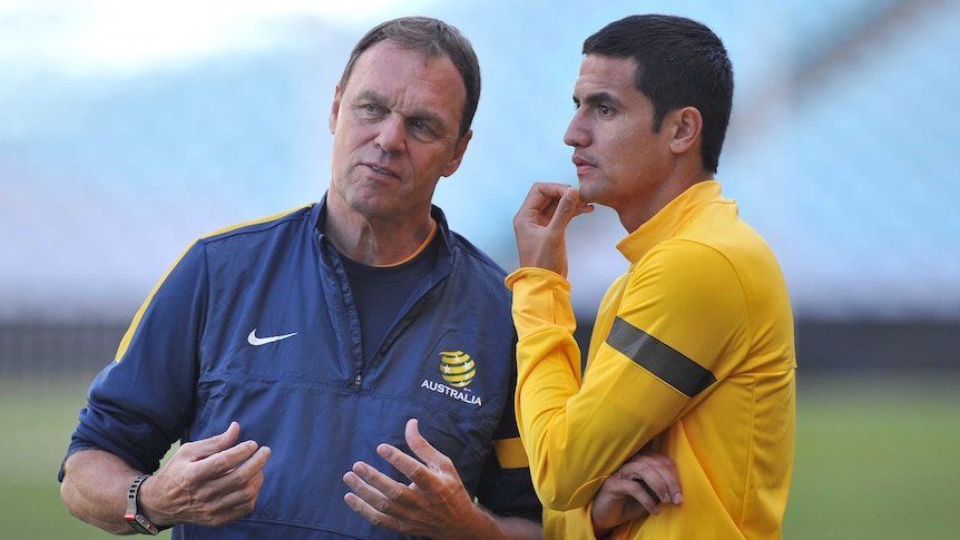 A March 19, 2013 file image of Socceroos coach Holger Osieck (L) speaking to Tim Cahill in Sydney.