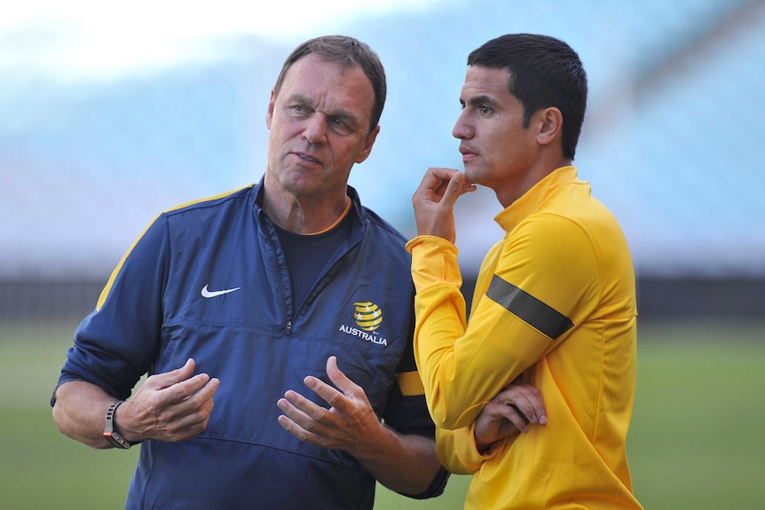 A March 19, 2013 file image of Socceroos coach Holger Osieck (L) speaking to Tim Cahill in Sydney.