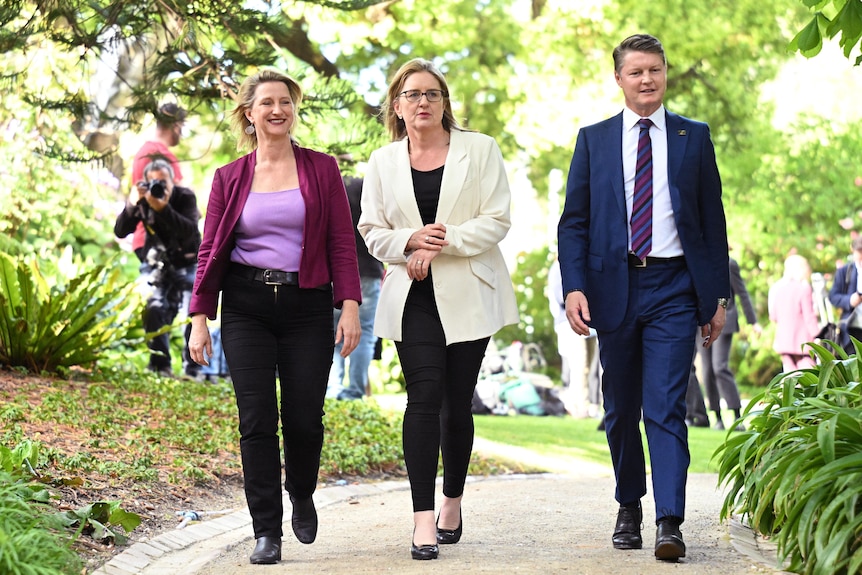 Premier-elect Jacinta Allan walks with her new deputy, Ben Carroll, and MP Vicki Ward after an outdoor press conference