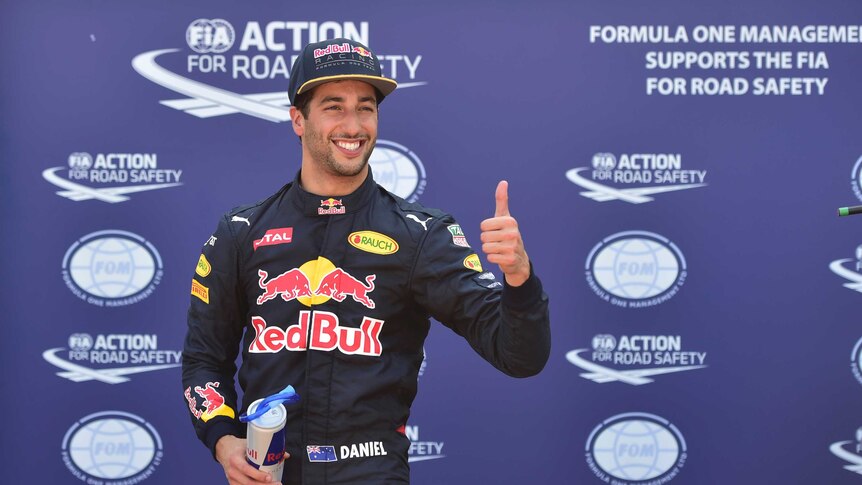 Daniel Ricciardo celebrates in the parc ferme during the qualifying session