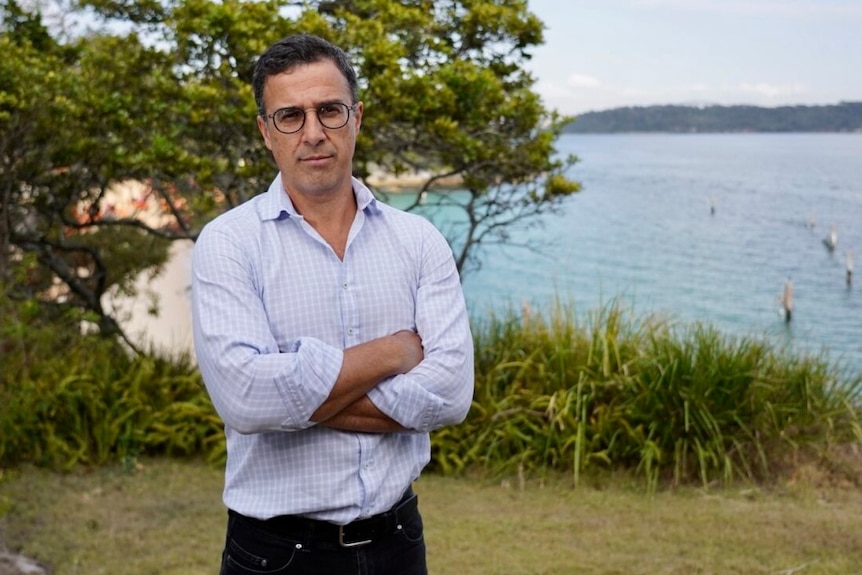 the mayor of woollahra council in sydney richard shields stands outdoors on a beach cliff 