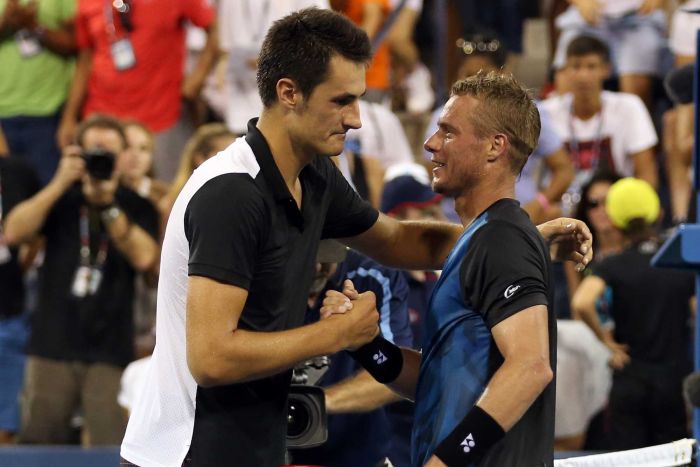 Australia's Bernard Tomic shakes hands with Lleyton Hewitt at the 2015 US Open at Flushing Meadows.