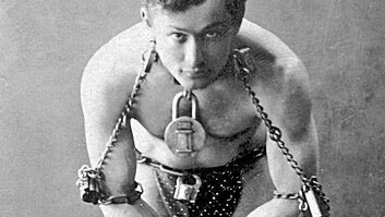 Portrait of man in chains.