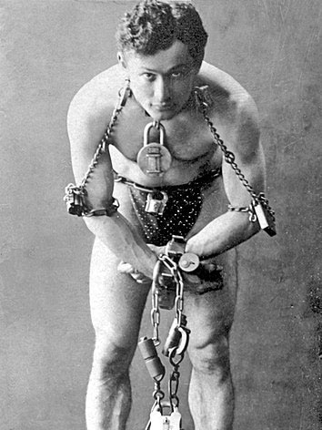 Portrait of man in chains.