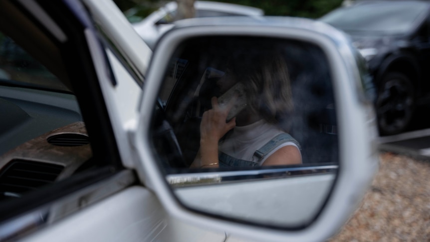 A woman sitting in a car.