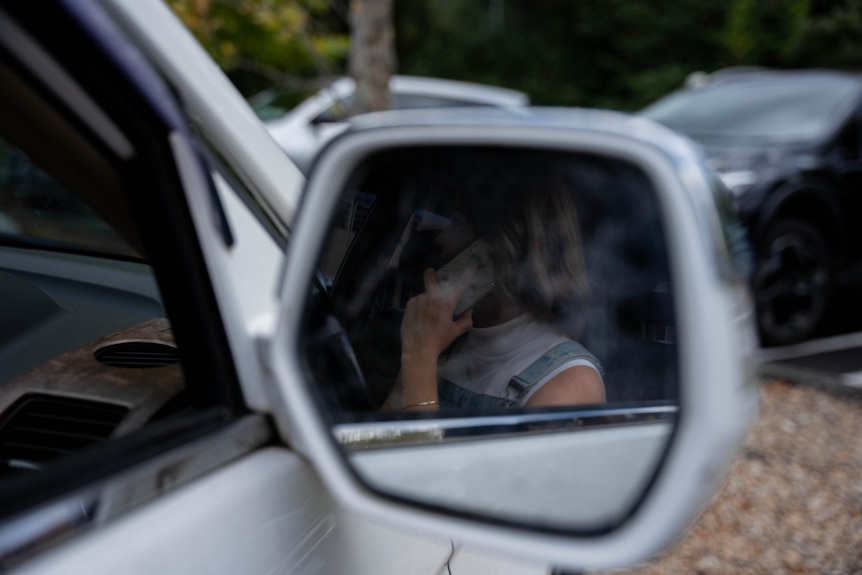 A woman sitting in a car.