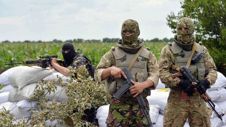 Ukrainian forces at a checkpoint near Slaviansk
