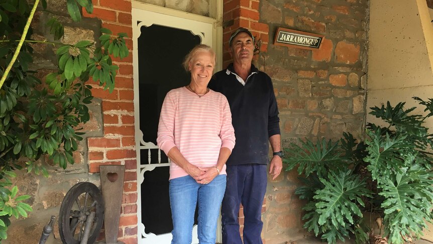 Tracy and Rex Parsons stand outside their homestead that formally housed Major Colin Cameron.