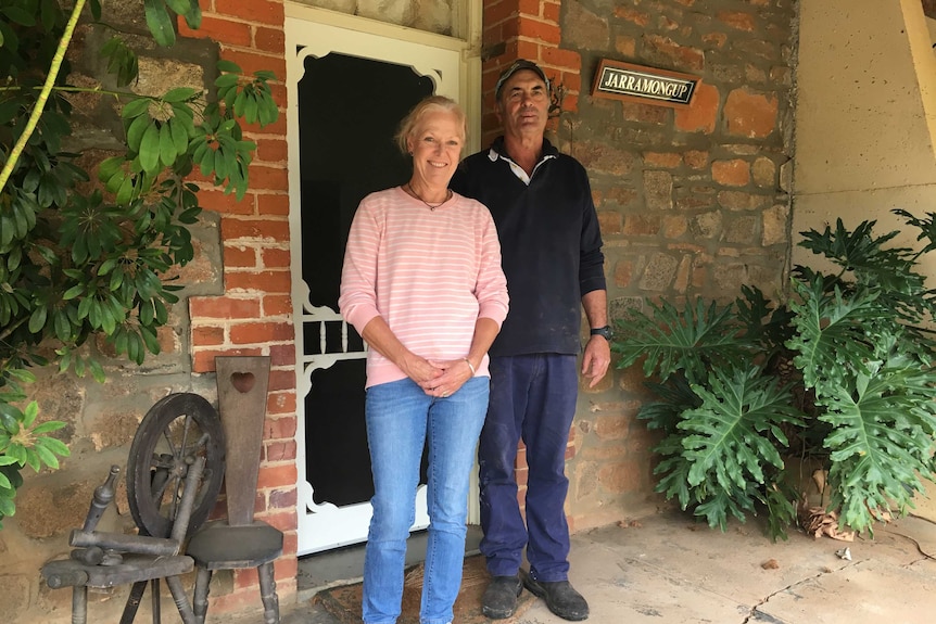 Tracy and Rex Parsons stand outside their homestead that formally housed Major Colin Cameron.