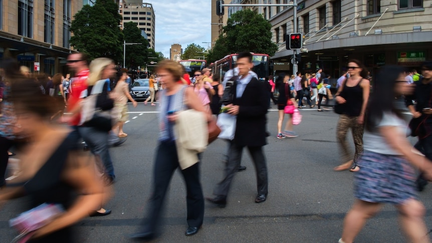 Pedestrians scramble to cross a Sydney street